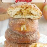 a stack of apple filled donuts on a plate.