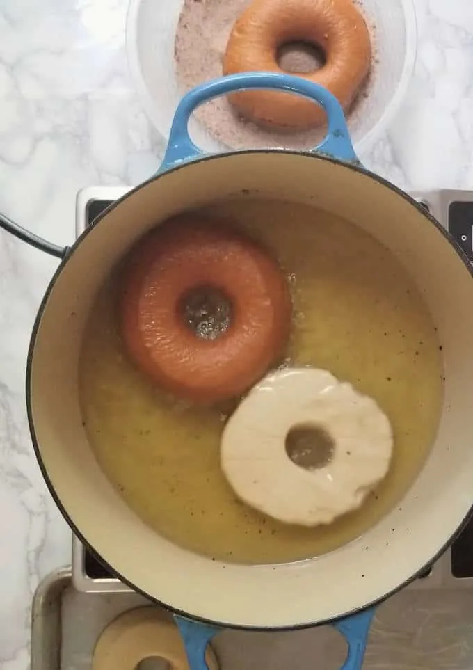 donuts frying in oil.