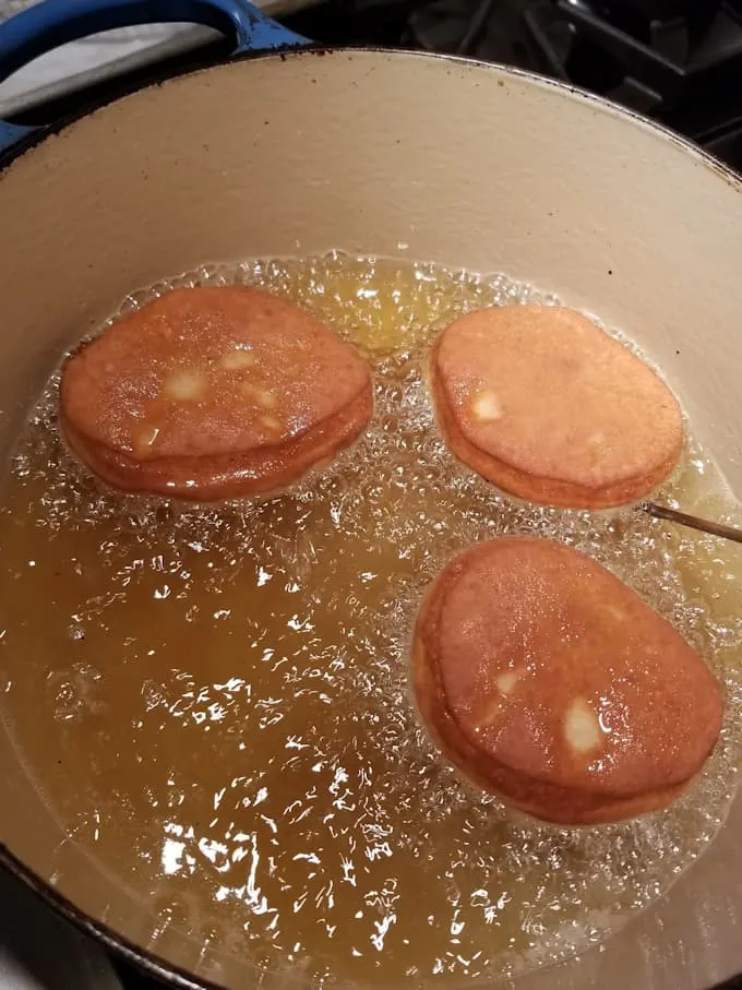 Donuts frying in oil