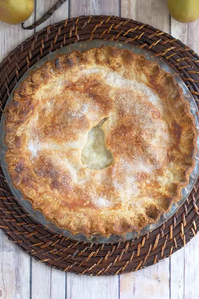 a pear pie on a wooden background.