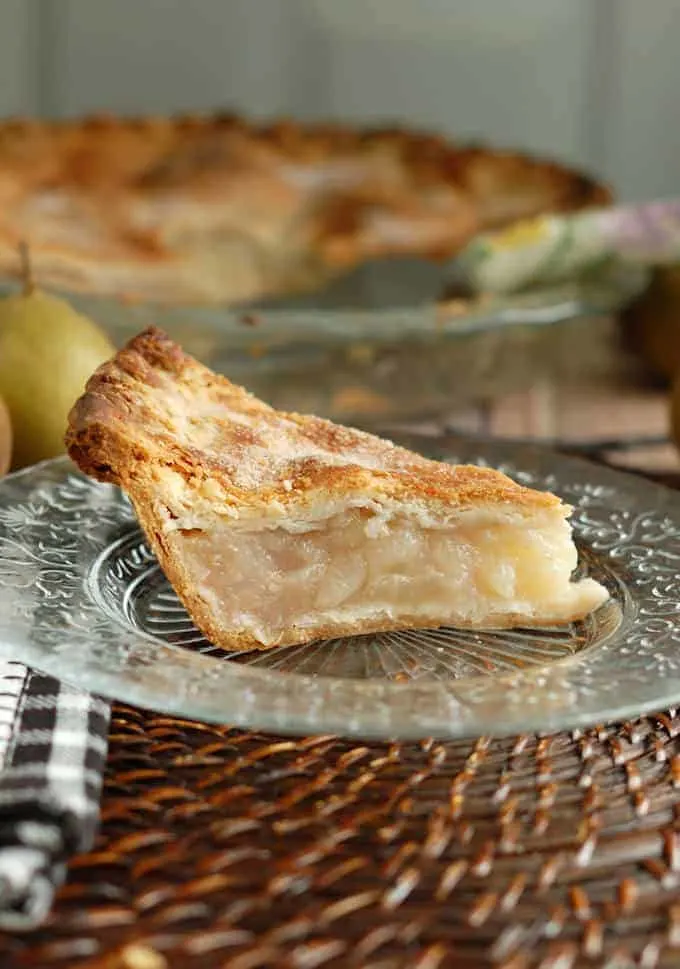 a slice of vanilla pear pie on a plate