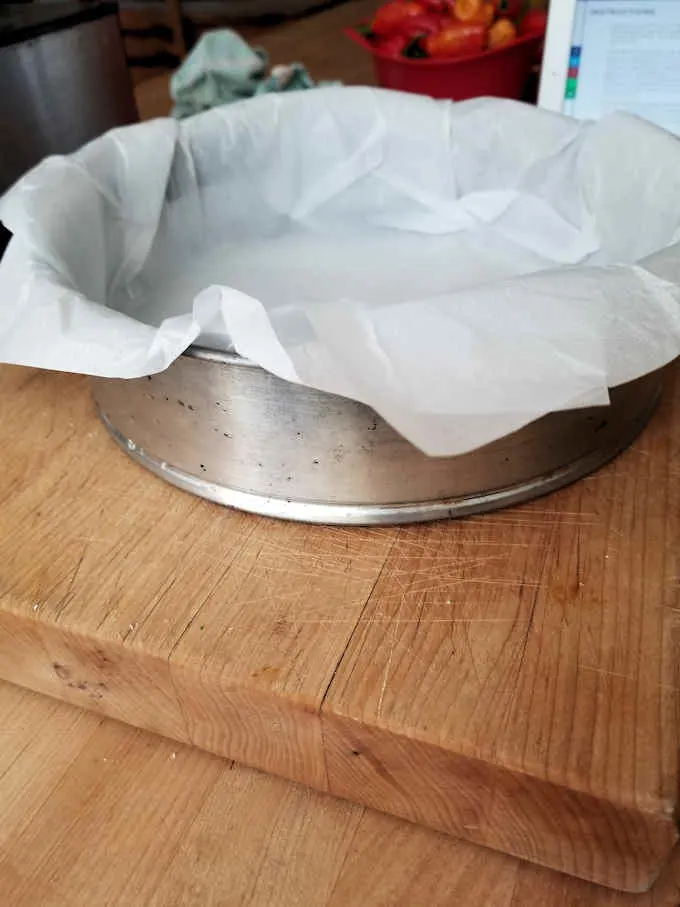 a spring form pan lined with parchment paper.