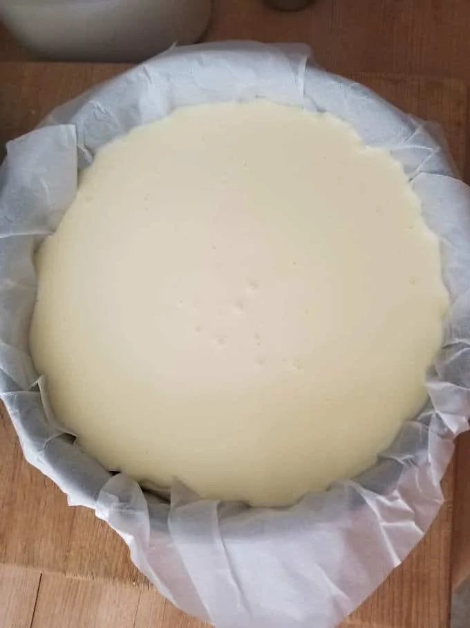 a spring form pan filled with cheesecake batter.