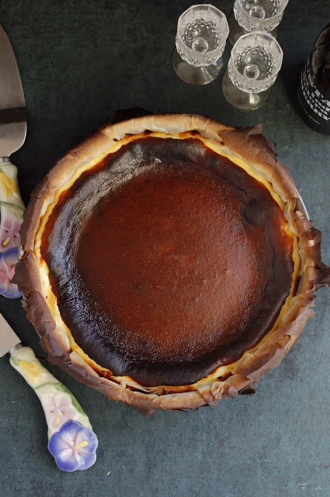 top view of a san sebastian cheesecake on a table.