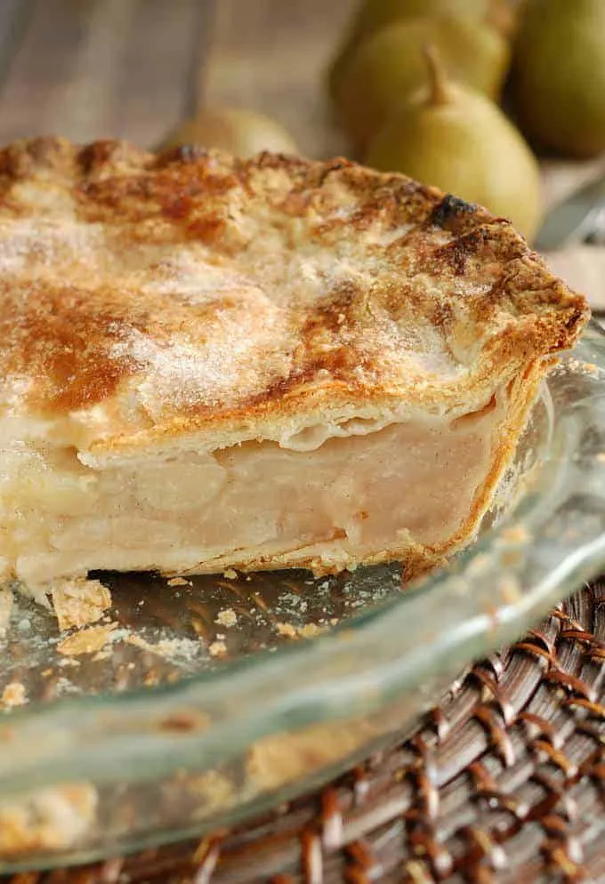 closeup shot of a pie showing the flaky sourdough pie crust