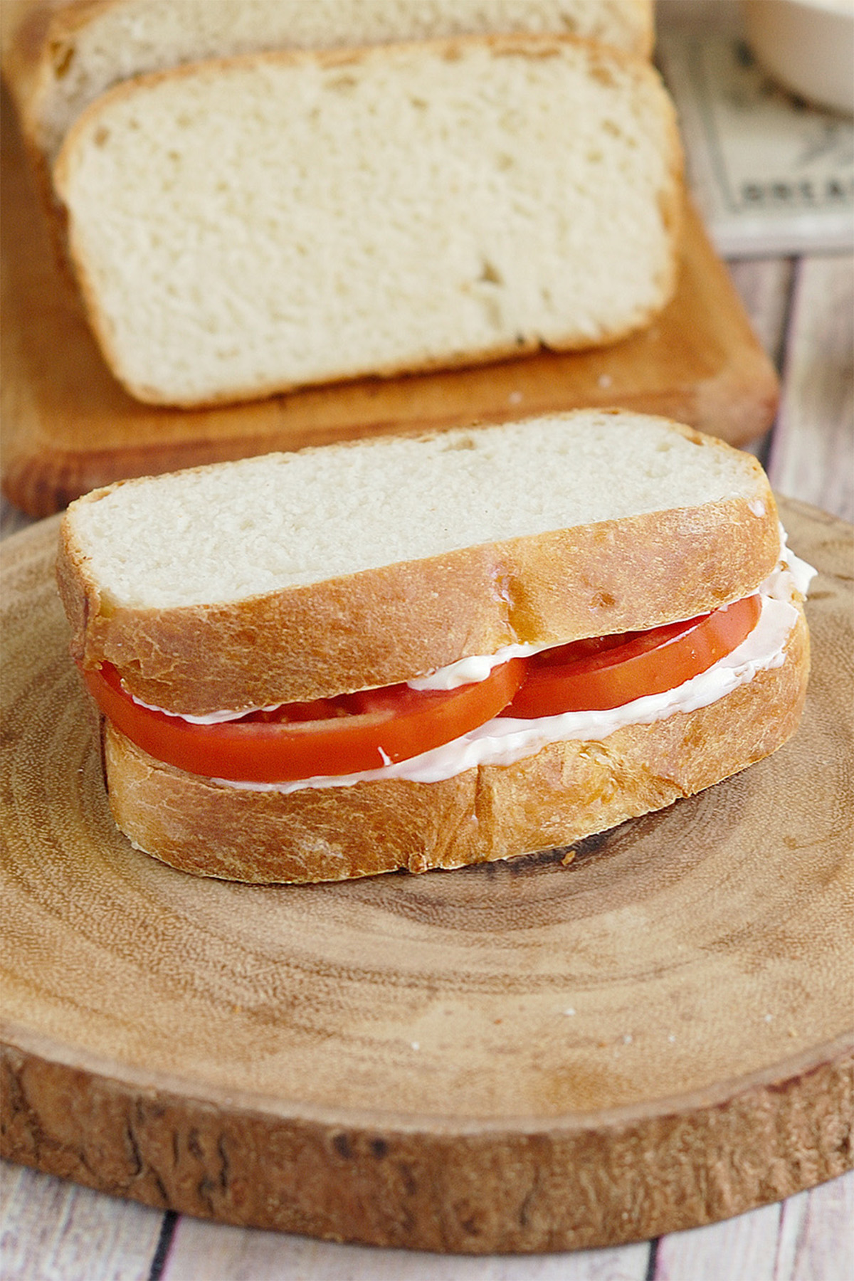 a tomato on sourdough sandwich bread.