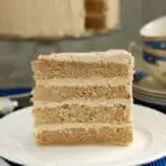 a slice of spice cake on a white plate