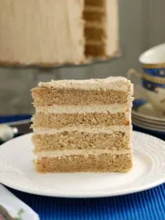 a slice of spice cake on a white plate