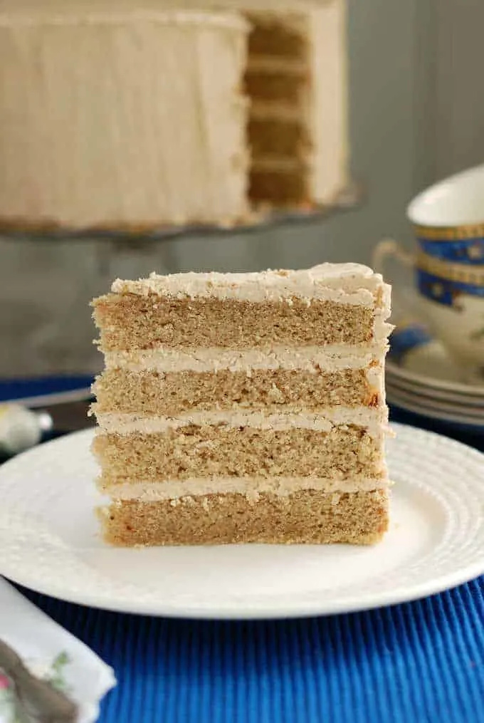 a slice of spice cake on a white plate