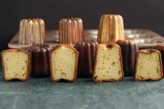 four caneles baked in different pans