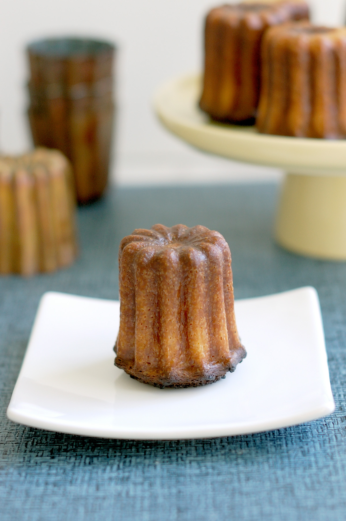 a canele on a white plate