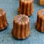 caneles on a blue surface