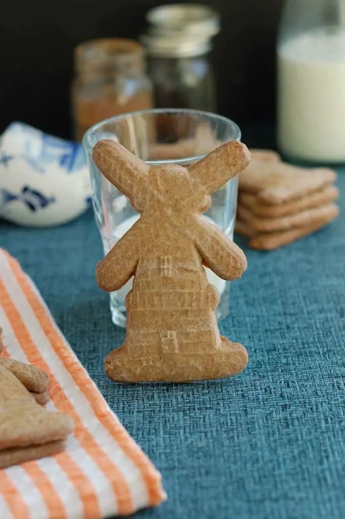 a speculaas cookie with a glass of milk