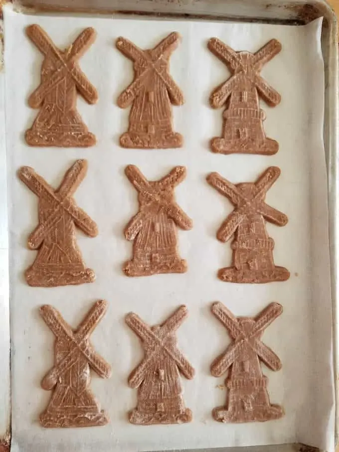 unbaked speculaas cookies on a baking pan