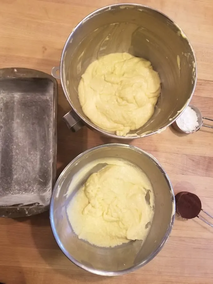 set up of batter, pan and cocoa for making marble pound cake