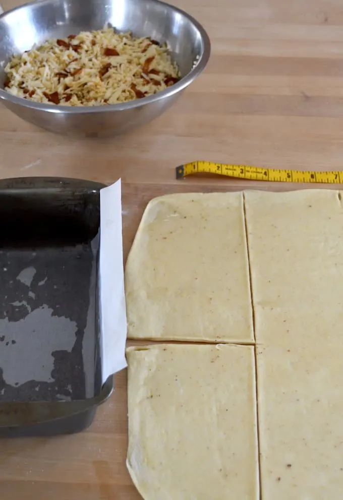 Bread dough marked and cut into 4" segments. 