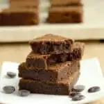 a stack of malted milk brownies on a plate