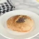 a sourdough bialy on a white plate