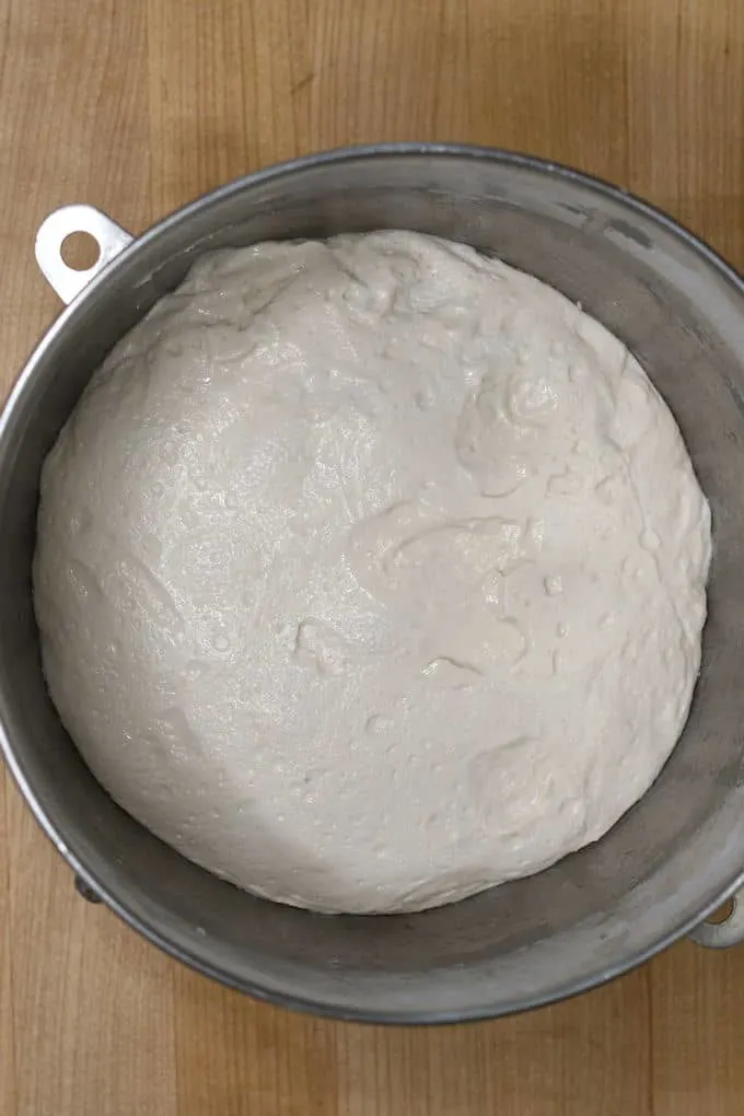a bowl of sourdough bread dough after a night in the refrigerator.