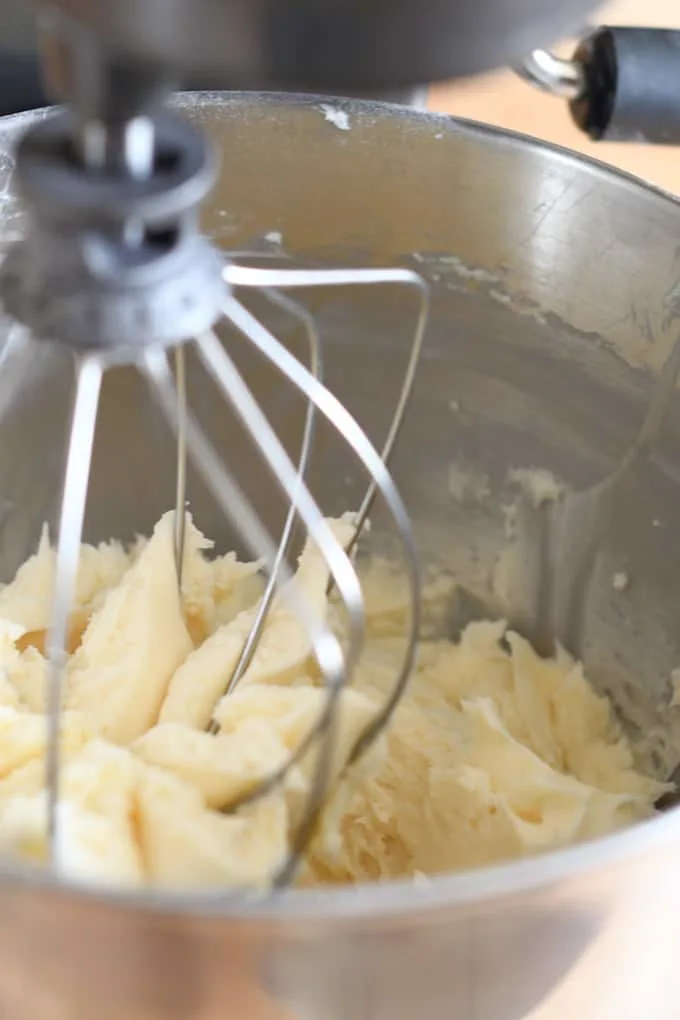 a mixer bowl with unwhipped american buttercream frosting