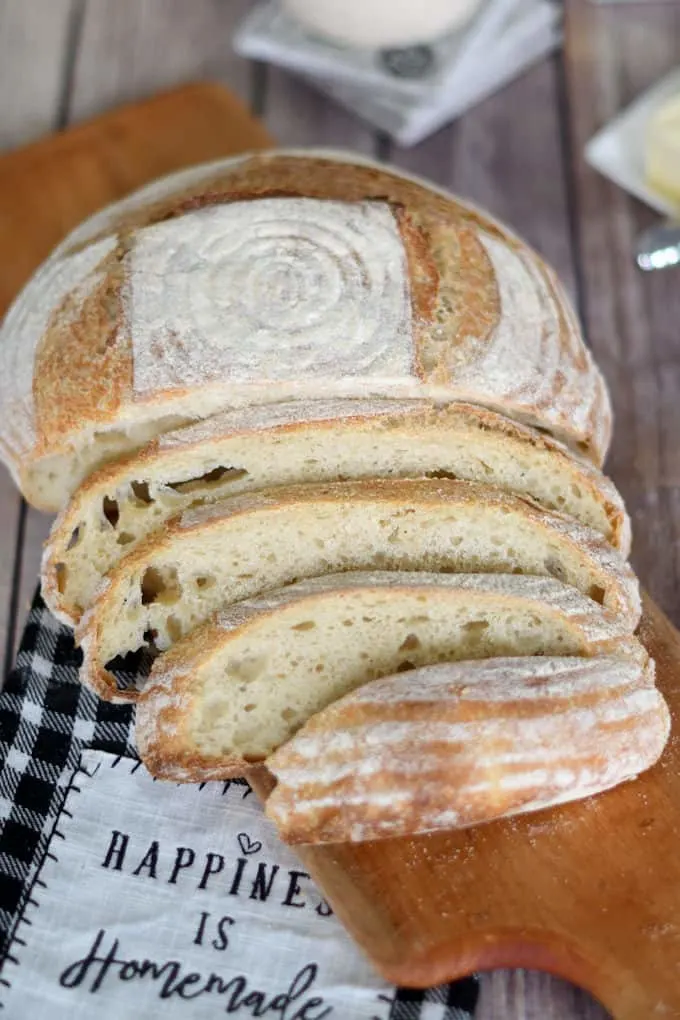 a sliced loaf of sourdough semolina bread on a cutting board