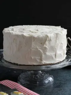 A frosted cake on a cake stand