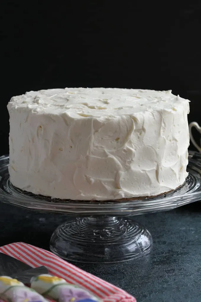 A frosted cake on a cake stand