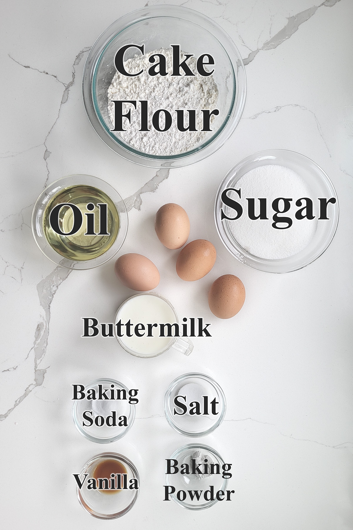 ingredients for vanilla buttermilk cake in glass bowls.