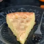 a slice of flourless almond cake on a plate