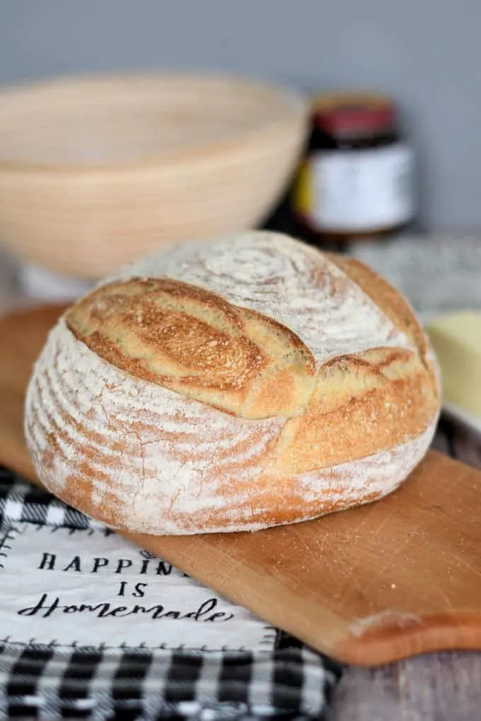 a loaf of crusty semolina bread on a cutting board