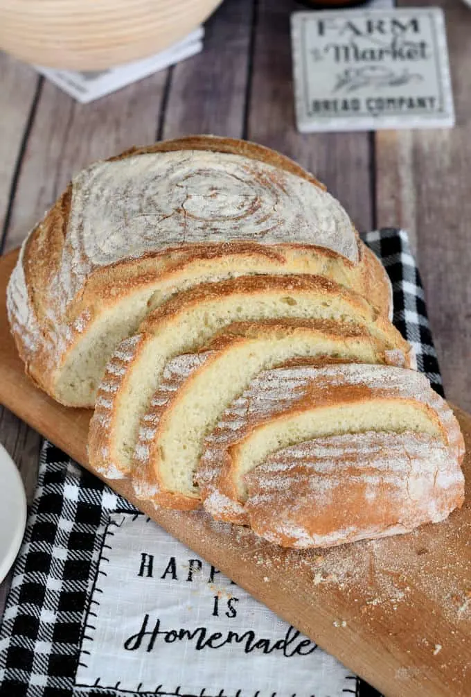 a sliced loaf of semolina bread on a cutting board