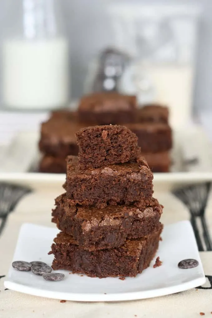 a stack of sourdough brownies on a white plate