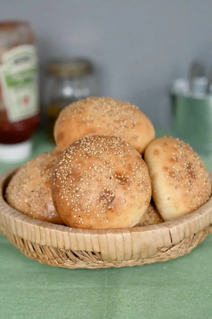 a basket of sourdough hamburger buns