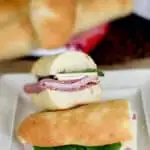a submarine sandwich on a fresh baked roll on a plate
