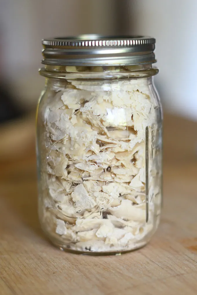 an image of a jar full of dried sourdough starter chips