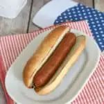 an image of a hot dog on a homemade bun with text overlay for pinterest