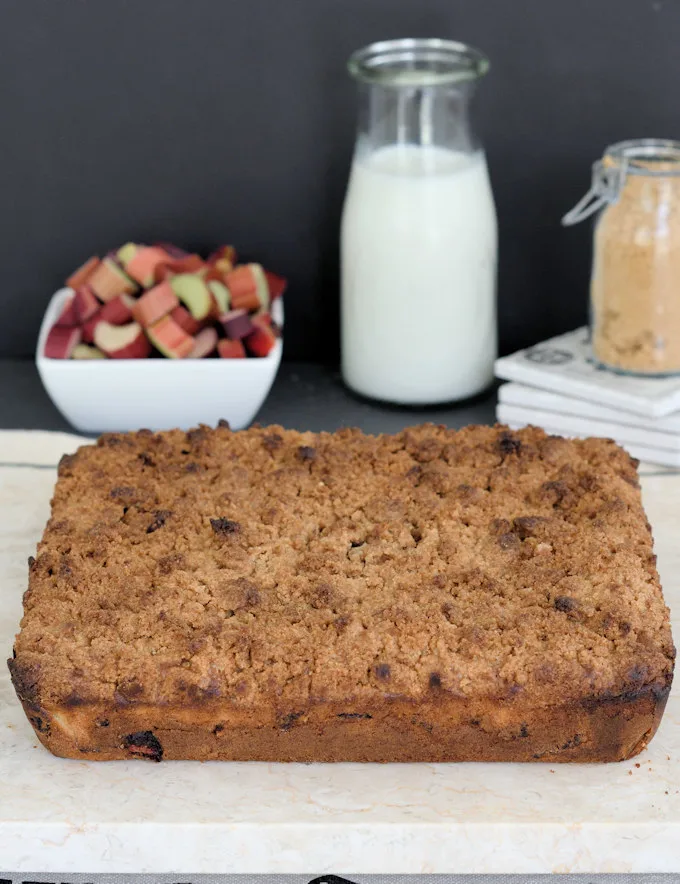 a crumb cake on a marble cutting  board 