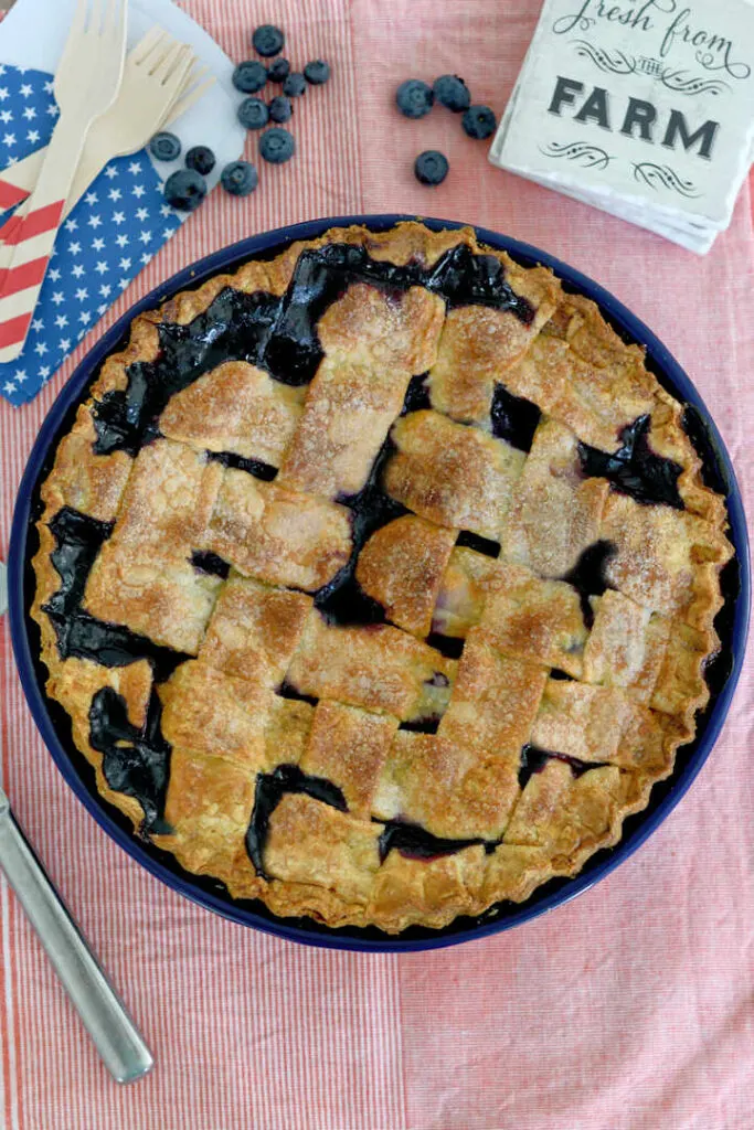 top view of a blueberry pie with a lattice crust 