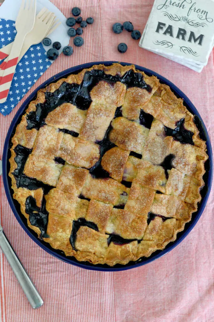 top view of a blueberry pie with a lattice crust