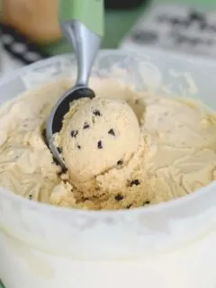 a bin of homemade cookie dough ice cream with a scoop
