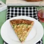 a slice of zucchini galette on a white plate