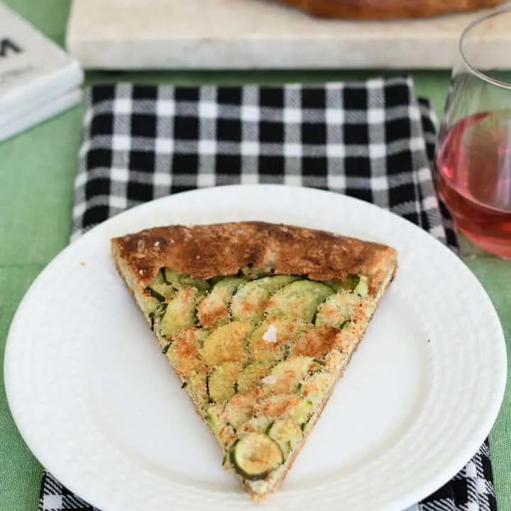 a slice of zucchini galette on a white plate