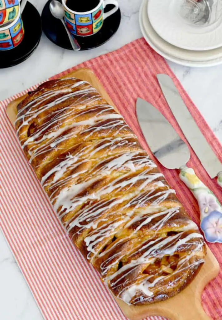 overview shot of an apple danish braid with icing drizzle