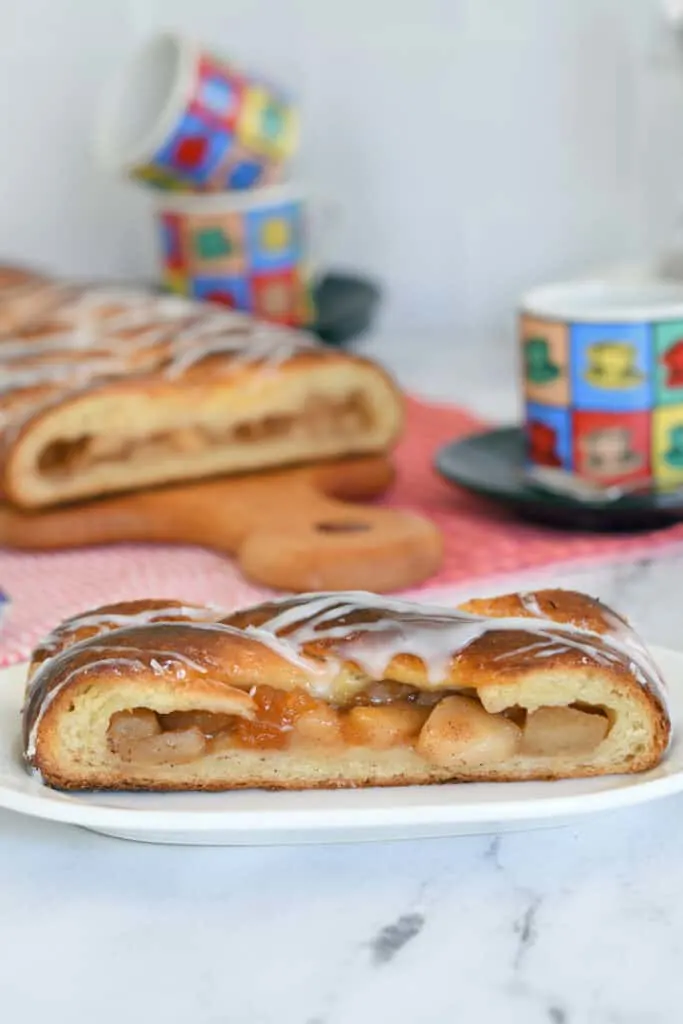 a slice of apple danish pastry on a plate