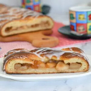 a slice of apple filled danish on a plate