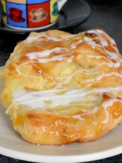 two homemade cheese danish on a plate