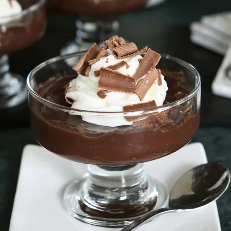 a glass dish filled with dark chocolate pudding