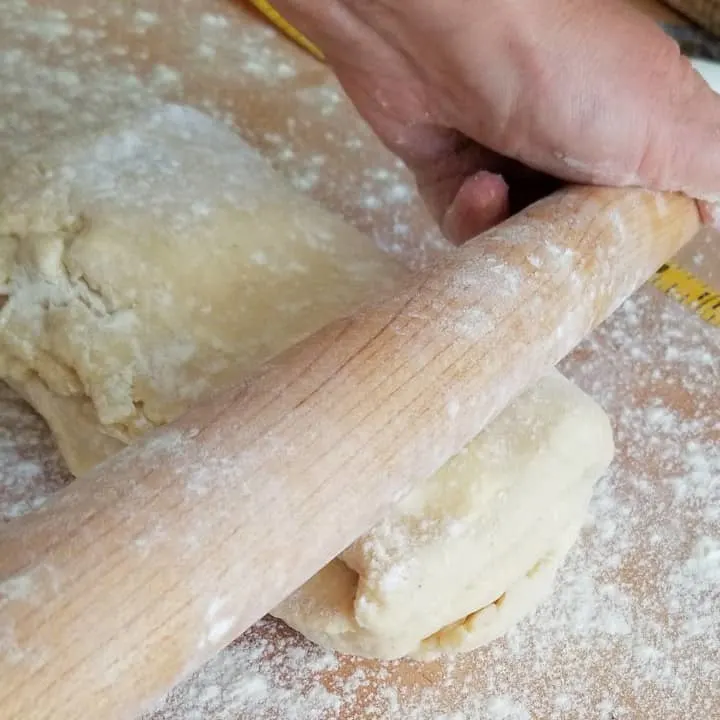 closeup of rolling danish pastry dough