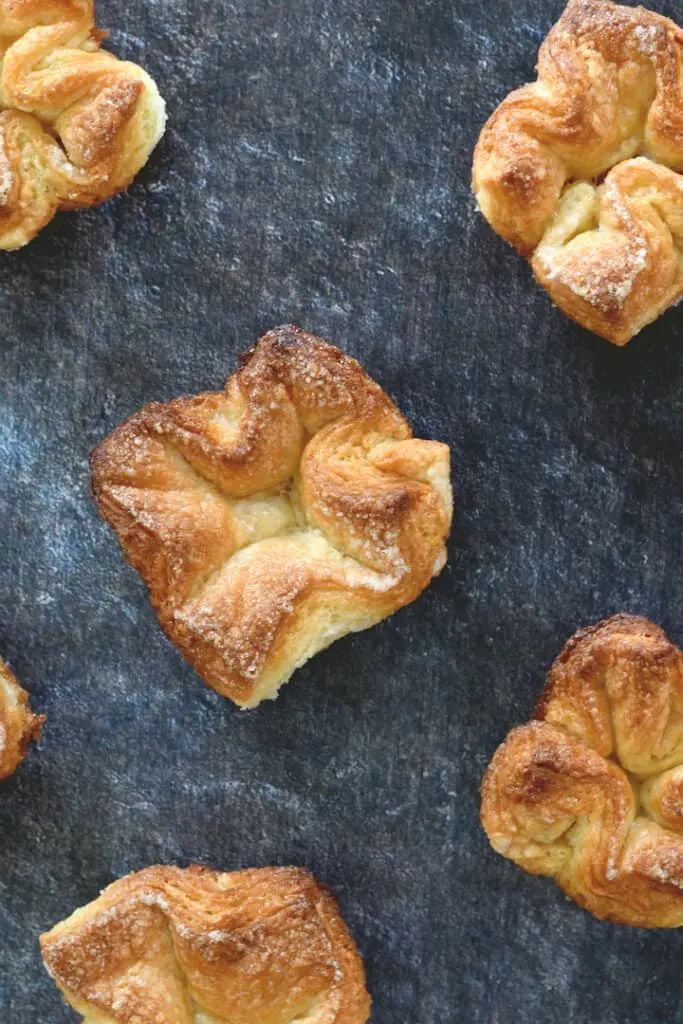 an overhead shot of several kougin-amann pastries