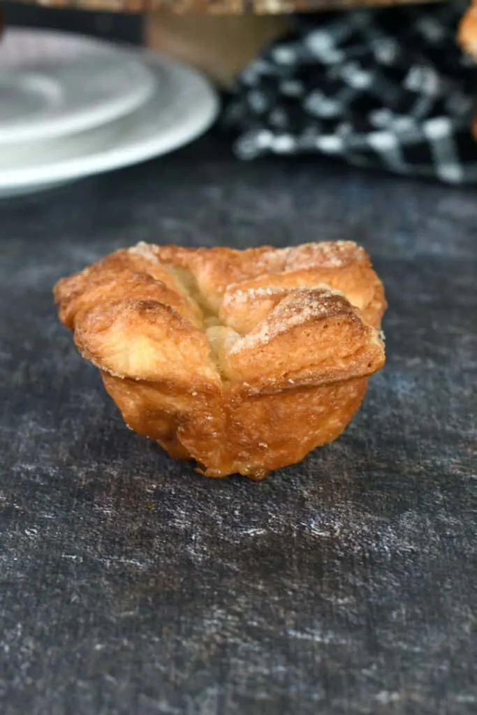 one kouign amann on a black surface